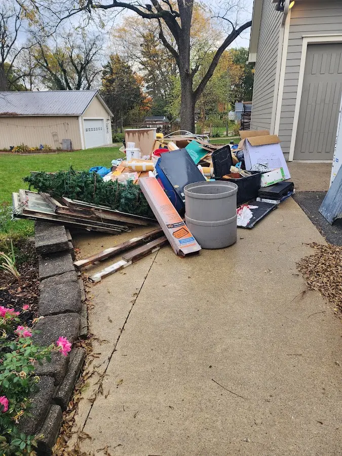 Dumpster being loaded with debris for 10 Yard Dumpster Rental in Shamong